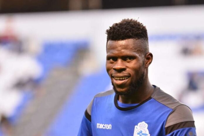 Francis Uzoho biography showing the Super Eagles goalkeeper in action for Nigeria